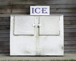 Vintage ice chest with two hinged doors, both locked, at marina